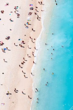 Aerial view of a beach with people sunbathing in summer, Zakynthos, Greek Islands, Greece