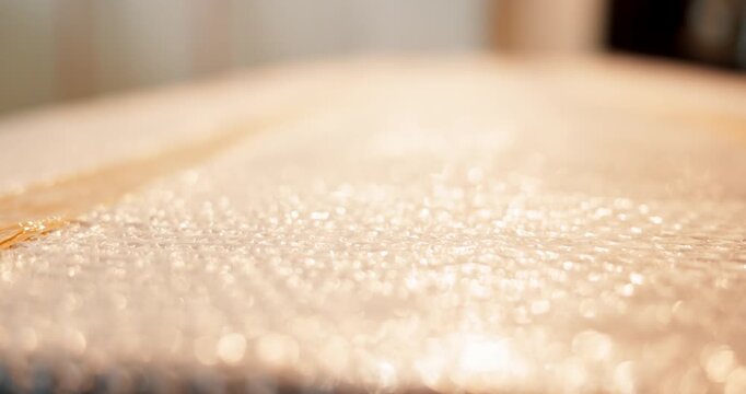 Bubble wrap, stock and shipping with box for safety, delivery and logistics for supply chain. Fragile goods, distribution and package tape for protection, plastic safeguarding or parcel cushioning