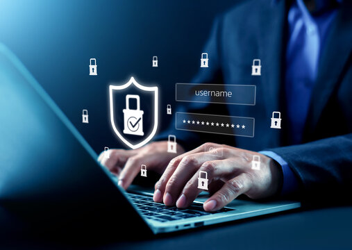 Business professional accessing a secure digital system by entering login credentials with cyber security protection, and data encryption concept, representing safe online account access.
