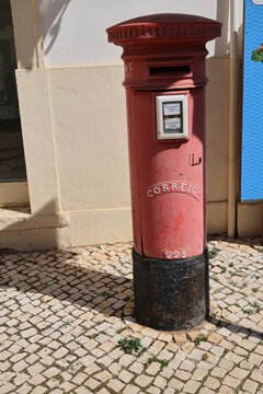 Red mailbox in the town of Silves, Algarve, Portugal 
