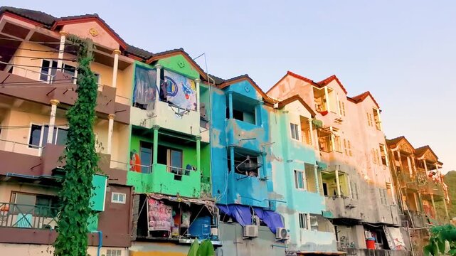 Old dirty apartment building tropical Thai nature Thailand.