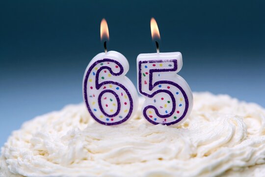 The 65 Birthday Candles on a Creamy Frosted Cake in Celebration