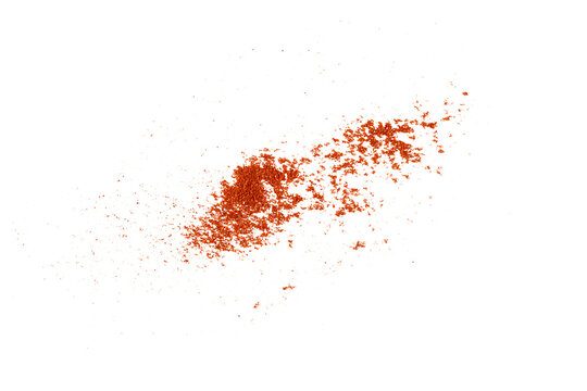 Scattered fine red paprika powder splash with flying dust particles isolated on transparent background for culinary design element