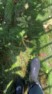 An explorer slops on the swampy, flooded area. Sound on: squash, squish and swish. One in waterproof boots carefully steps on the deluged soil