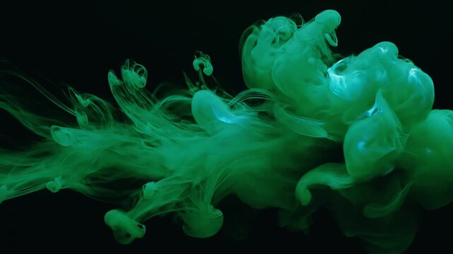 Vibrant green liquid or smoke swirling abstractly against a dark background, creating an ethereal and dynamic visual effect.