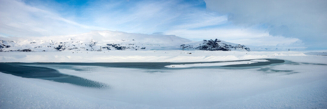 Large frozen lake and mountain range in Iceland Northern Region