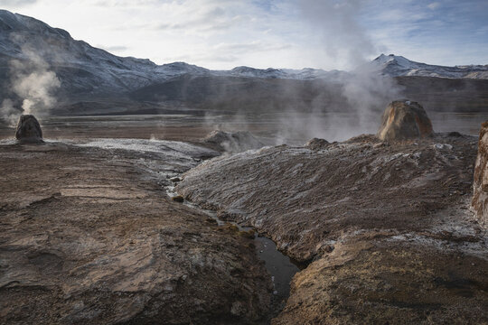 Steaming geysers in a high altitude volcanic landscape