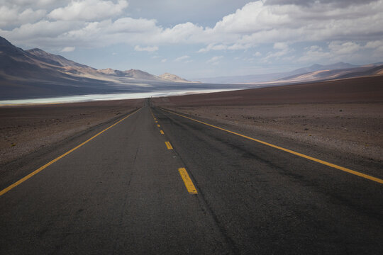 Long empty highway stretching into the desert
