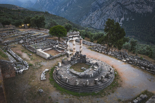 Ancient Greek ruins of the Tholos of Delphi at twilight