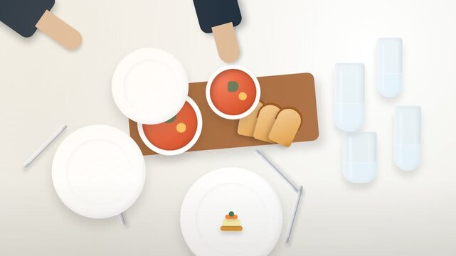 Overhead view of a table set for a meal with two bowls of soup bread and drinks as hands reach for the food.