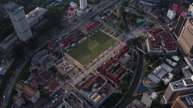 Aerial footage circling Dataran Merdeka with the historic field and urban Kuala Lumpur skyline visible from above.