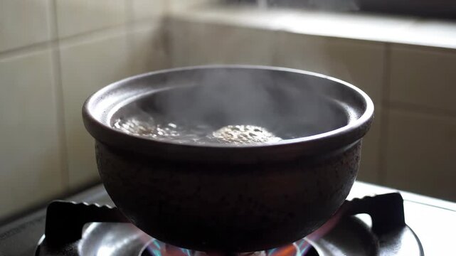 Casserole stew on gas stove, casserole stew steaming hot
