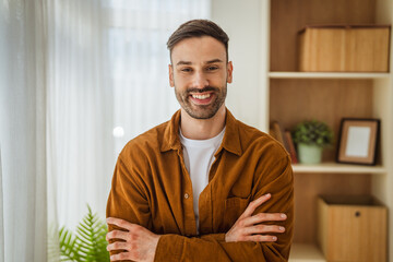 Fototapeta premium Young man smiling looking away feeling happy