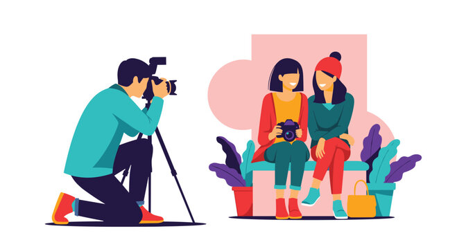 Professional male photographer using a camera on a tripod to take a portrait of two happy young women sitting together on a bench.