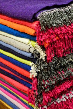 Colorful Stacked Woven Blankets With Fringe