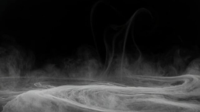 Ethereal white smoke wisps swirling and dancing against a deep black background creating a mystical and atmospheric abstract visual