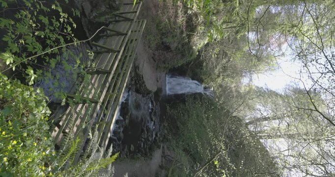 wooden bridge and woodland paths leading to the Gleno Waterfall