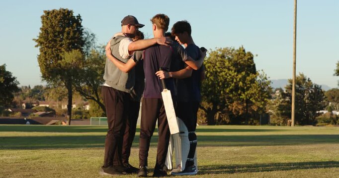 Diverse cricket players huddling after coach beckoning pep talk, exiting, bats, coach clapping