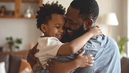 Fototapeta premium Happy African American father hugging young son.