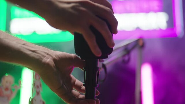 Removing podcast microphone from table arm close-up 4K	