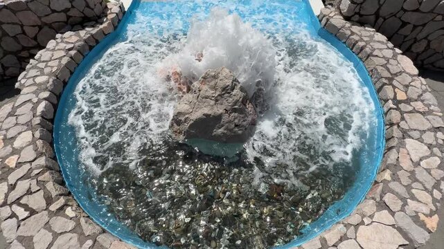 A powerful artesian spring gushing crystal-clear water, fully developed for public use.
