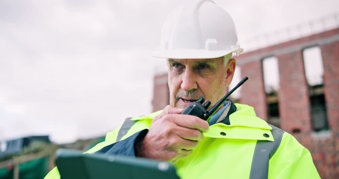Man, tablet and radio on construction site for task brief, inspection or safety update. Industrial, communication and mature engineer with tech, progress report or project coordination for renovation