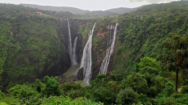 A wide view of Jog Falls showcasing cascading water and scenic natural landscape during monsoon