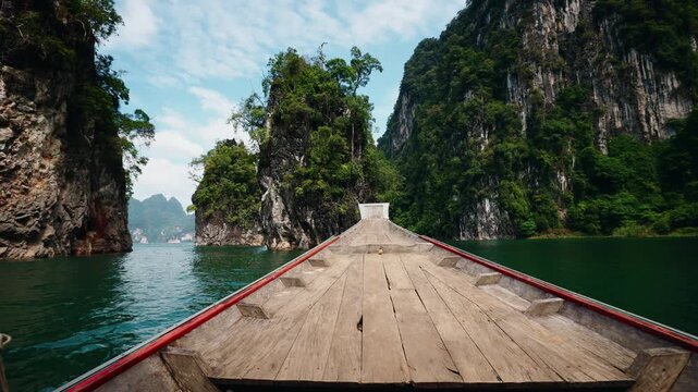 Khao Sok national park in Thailand, scenic limestone cliffs, serene waters.