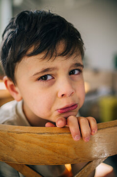 Portrait of an upset child with tears indoors