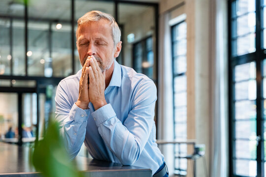 Business portrait of pensive executive in modern office environment