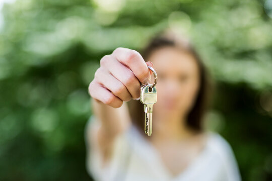 Close-up of woman holding key