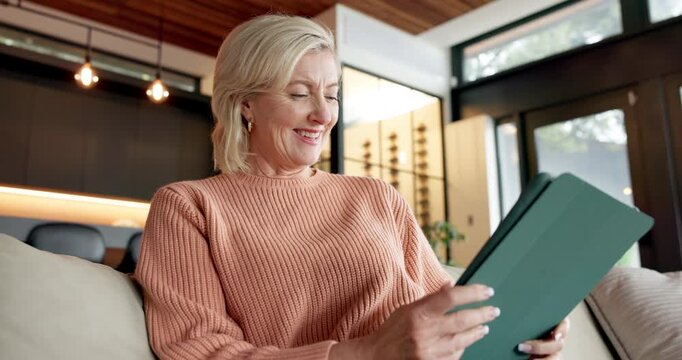 Reading, freelancer and happy woman with tablet in home for ebook update, draft or story review. Technology, remote work and mature author on sofa, editing manuscript and planning with smile at house