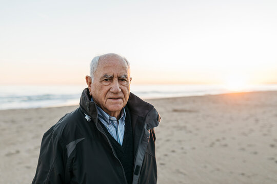 Senior man strolling at the beach