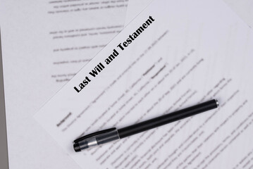 Naklejka premium Last Will and Testament document lying on a table, concept of estate planning, inheritance, and legal paperwork.