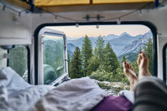 Beautiful view of mountain range and trees seen through camper van, Col d'Izoard, Arvieux, France