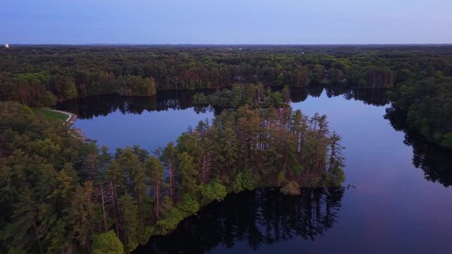 Twilight at Harold Parker State Forest with an island full of pine trees and nature, Andover, Massachusetts