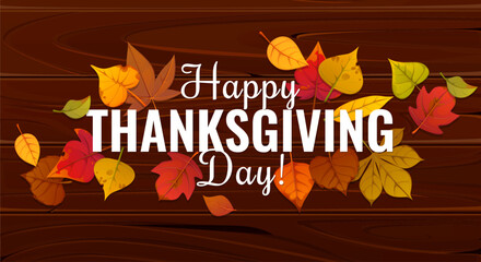 Happy Thanksgiving Day greetings with autumn leaves on wooden background. Thanksgiving Day festive banner for fall season holiday with autumn leaves of maple, oak, birch and elm or acorn tree foliage © Vector Tradition