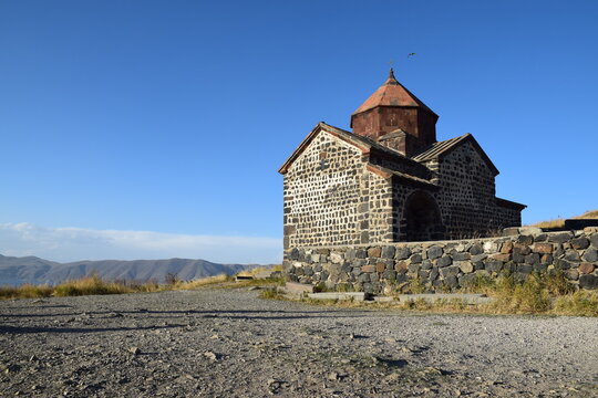 Sevanavank monastery Lake Sevan Armenia red dome mountain sky