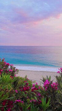 Beautiful Sunset Coast Overlooking Turquoise Sea With Blooming Flowers, Himare - Albania.