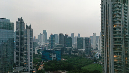 Fototapeta premium Dense Urban Skyline Features Towering Skyscrapers And Modern Highrise Buildings Overlooking Large