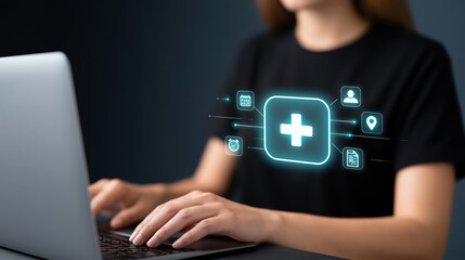 Fototapeta premium Woman typing on laptop with health care icon interface, digital medicine concept, online medical service
