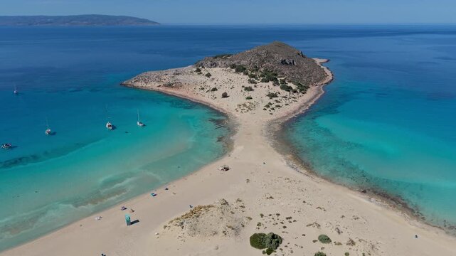 Discover the stunning turquoise waters and soft sands of Simos Beach in Elafonisos, Greece. Experience the serene landscape, harmonizing relaxation and adventure in a tropical paradise.