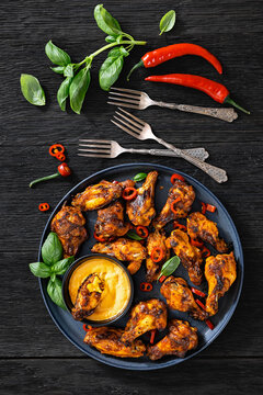 Roasted chicken wings appetizer with dip on plate
