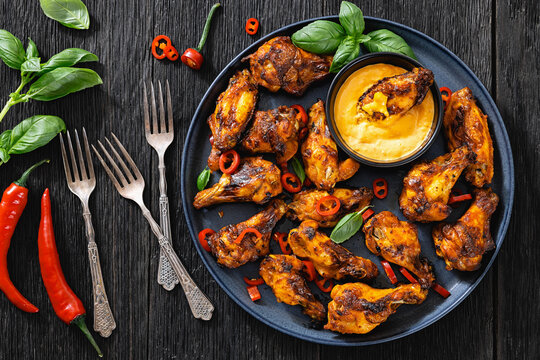 Roasted chicken wings appetizer with dip on plate