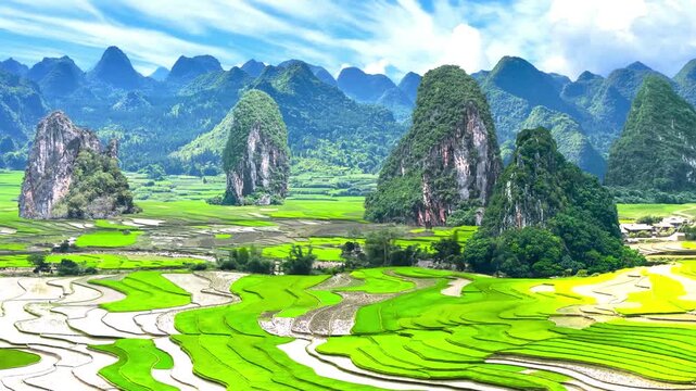 Drone aerial view of majestic green rice terraces and karst mountains in Zhangjiajie China for a scenic nature and travel concept