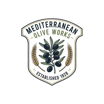 Elegant olive branch logo with dark olives and wheat stalks inside a heraldic shield.