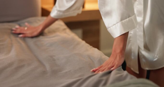 Cleaning, hands and woman making bed in home for daily routine, fresh fabric or maintenance. Change, morning and tidy with person in bedroom of apartment for chores, housework or responsibility