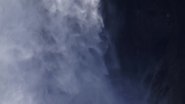 Extreme slow motion close up of base of Upper Yosemite Falls as water crashed against the cliffside in Yosemite National Park, California.