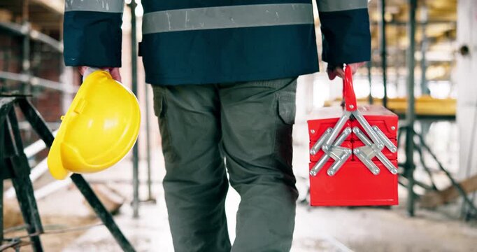 Hands, architect or walking with helmet or toolbox on construction site for safety or security. Back view, person or contractor with equipment or gear for building project or architecture development