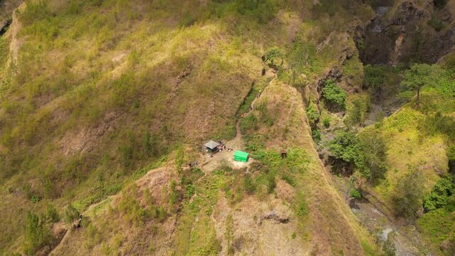 Hiking Trail Waypoint Mount Rinjani Cloud Rolling Down Foothills Lombok Indonesia Drone Pan Up 4K 60FPS